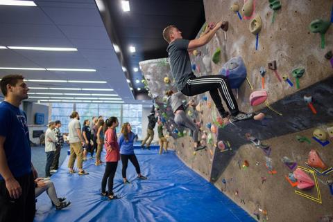 unh students on the climbing wall