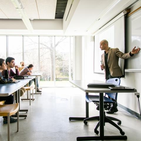 professor with students in classroom
