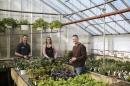 Owners in greenhouse